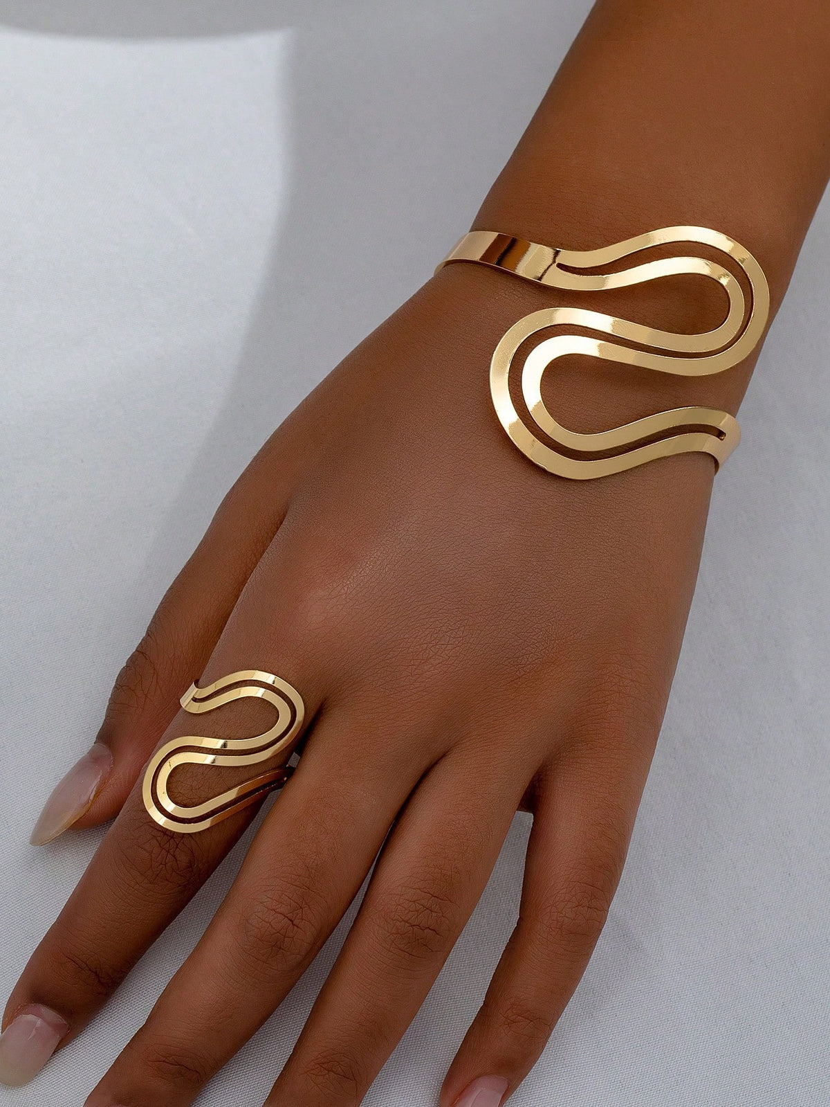 Set bracelet et bague dorés design vague